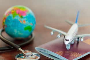 Stethoscope , passport document, airplane and globe. Healthcare and travel insurance concept