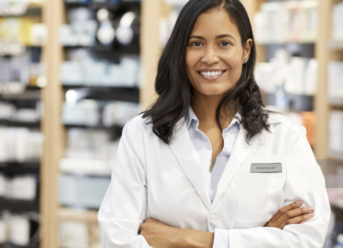 Woman pharmacist happily welcoming you to the pharmacy.